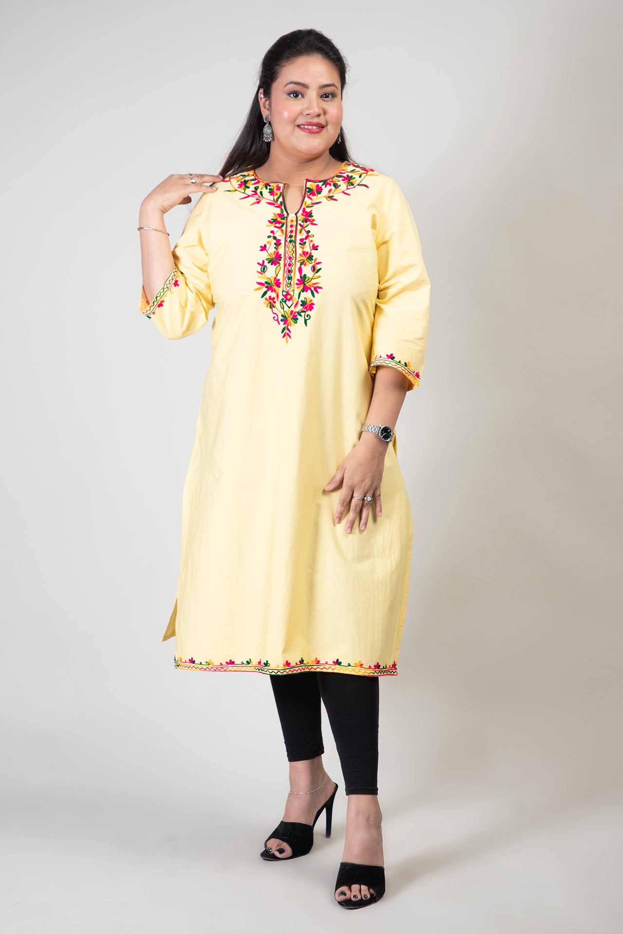 Yellow Coloured Premium Kashmiri Long cotton Kurti Styled with small U-slit cut at Front and Graced with Double shaded Multi Colour Floral Aari Work embroidery.