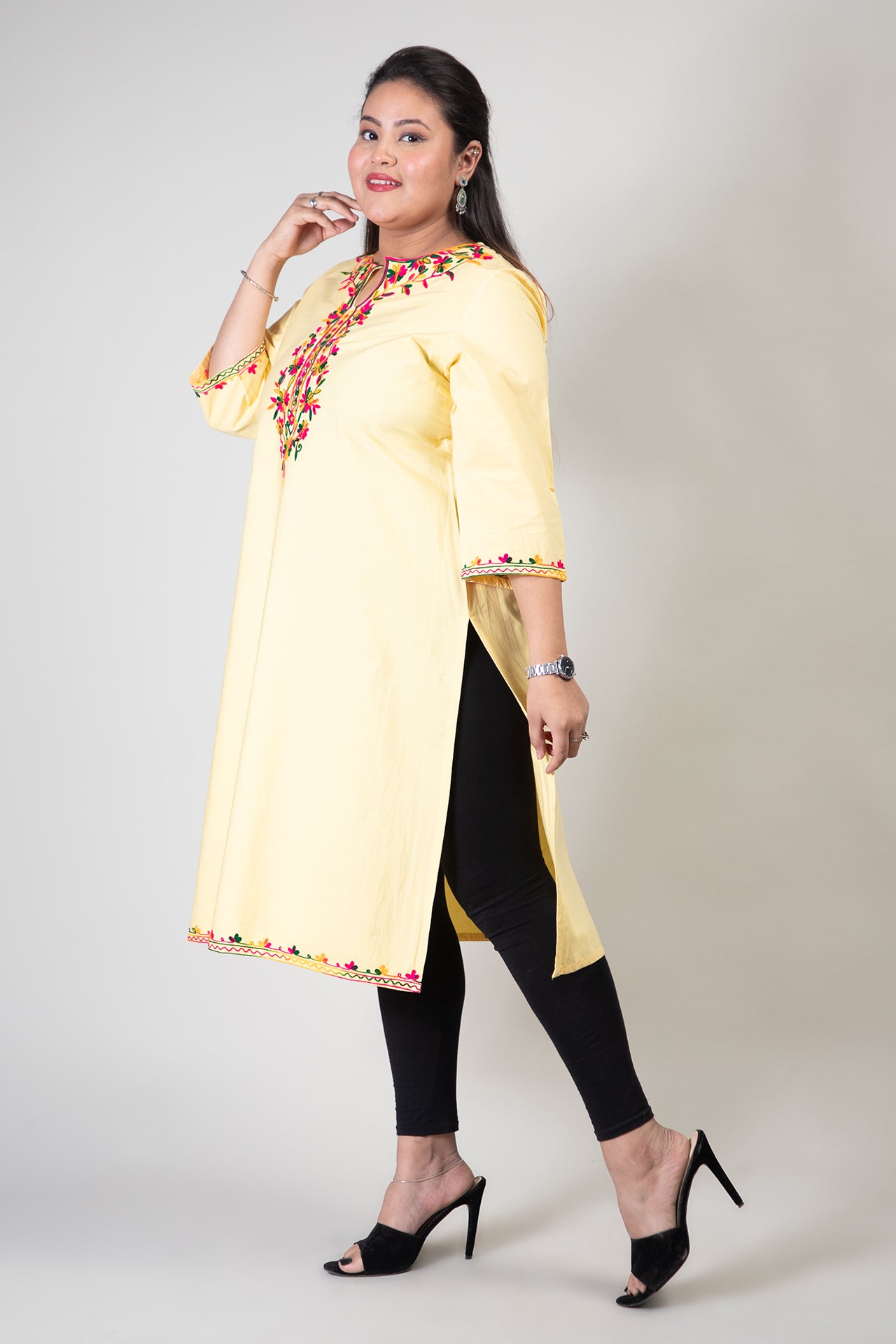 Yellow Coloured Premium Kashmiri Long cotton Kurti Styled with small U-slit cut at Front and Graced with Double shaded Multi Colour Floral Aari Work embroidery.