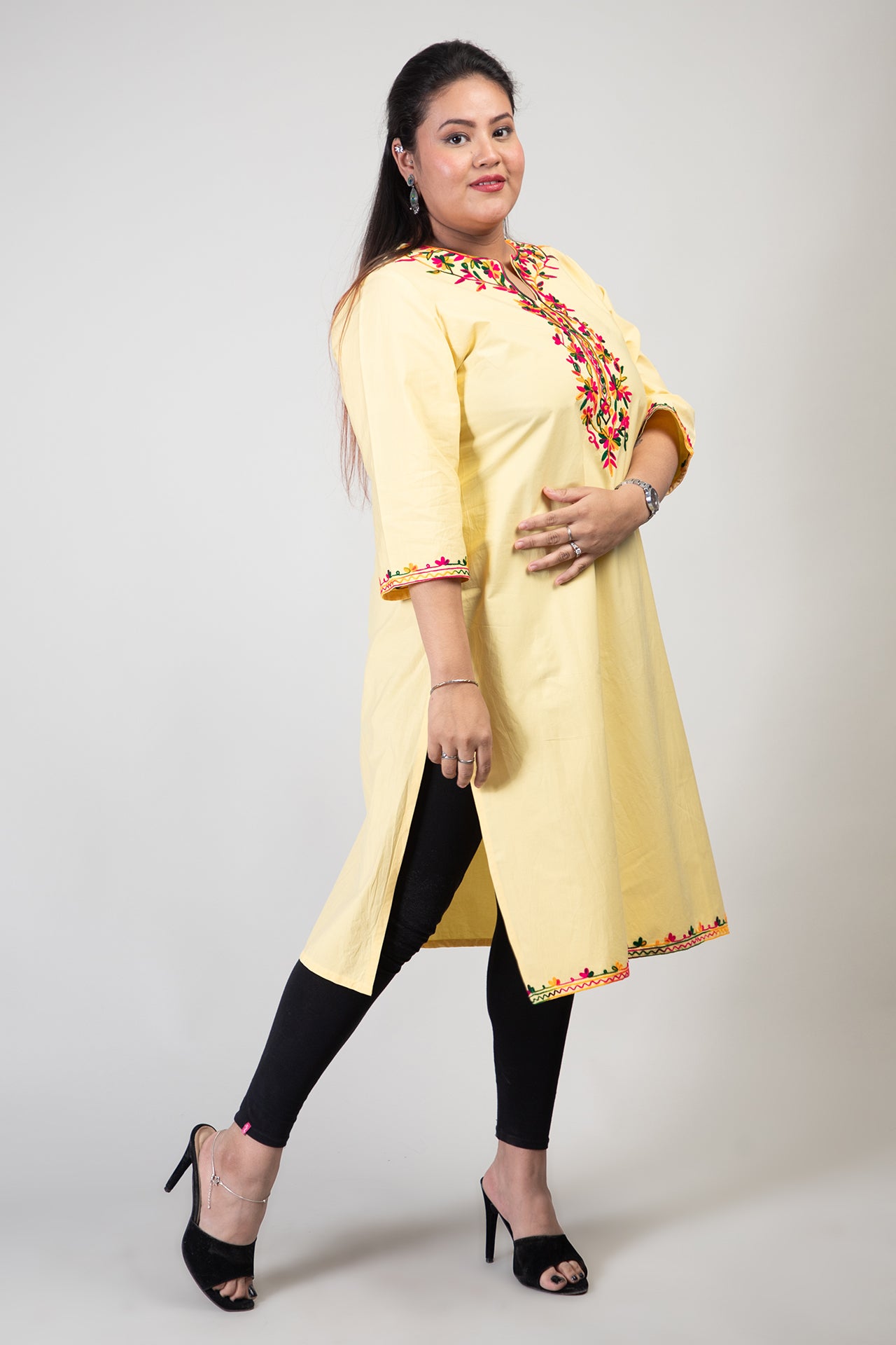 Yellow Coloured Premium Kashmiri Long cotton Kurti Styled with small U-slit cut at Front and Graced with Double shaded Multi Colour Floral Aari Work embroidery.