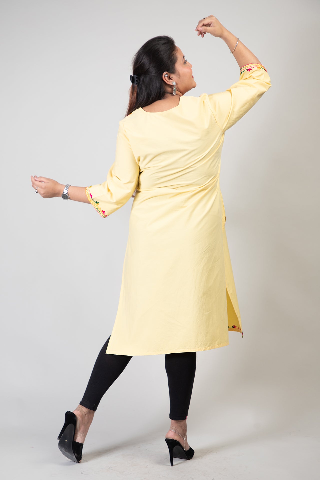 Yellow Coloured Premium Kashmiri Long cotton Kurti Styled with small U-slit cut at Front and Graced with Double shaded Multi Colour Floral Aari Work embroidery.