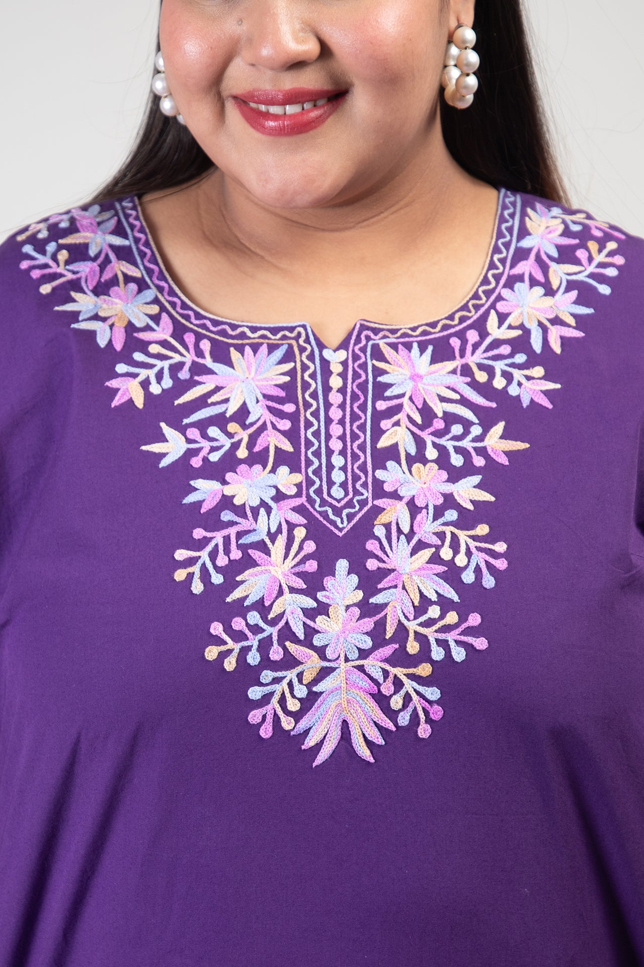 Purple Coloured Premium Kashmiri Short cotton Kurti Styled with small V-slit cut at Front and graced with light Multi Colour Floral Aari Work embroidery
