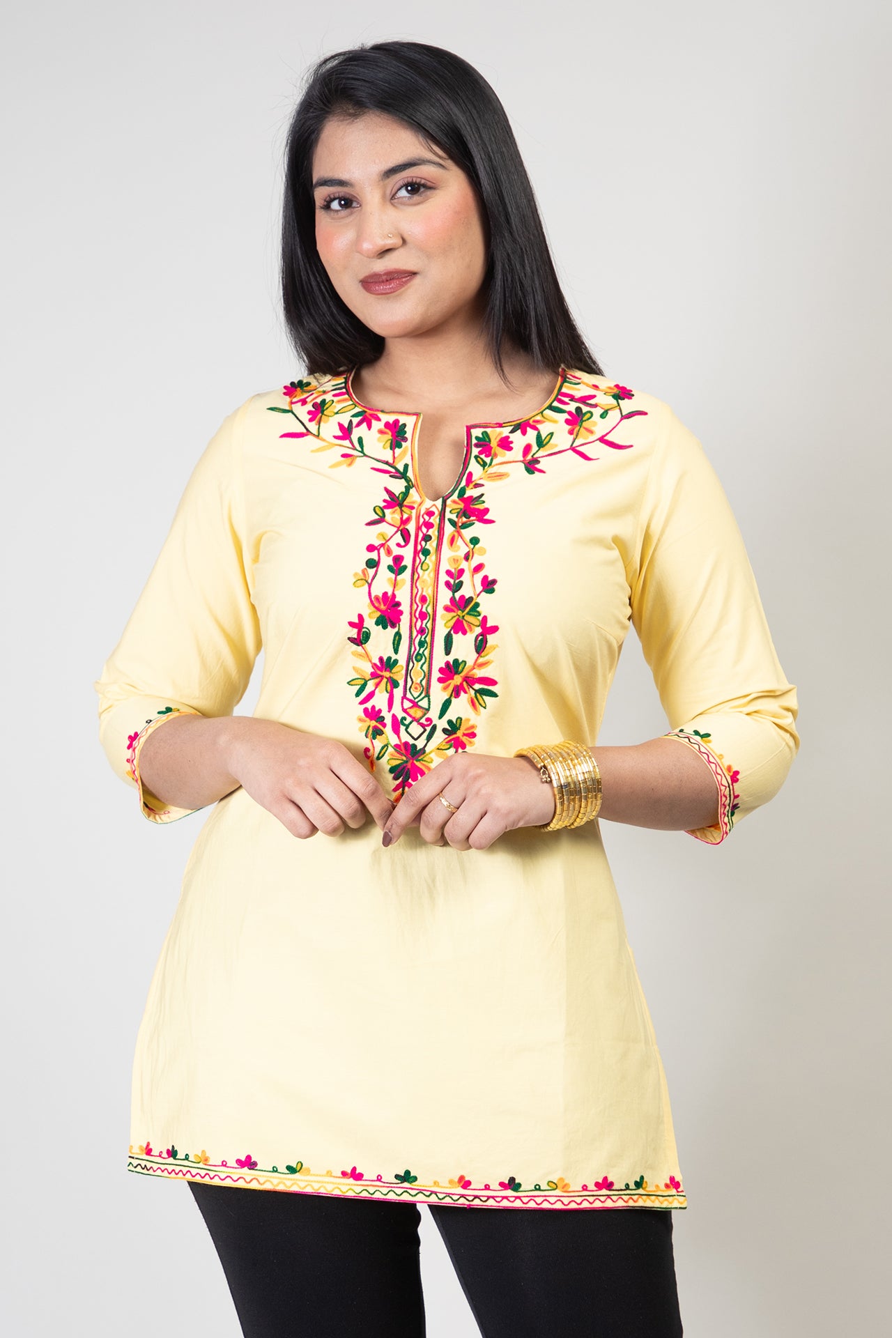 Yellow Premium Kashmiri Short cotton Kurti Styled with small U-slit cut at front and graced with Multi colour Floral Aari Work embroidery