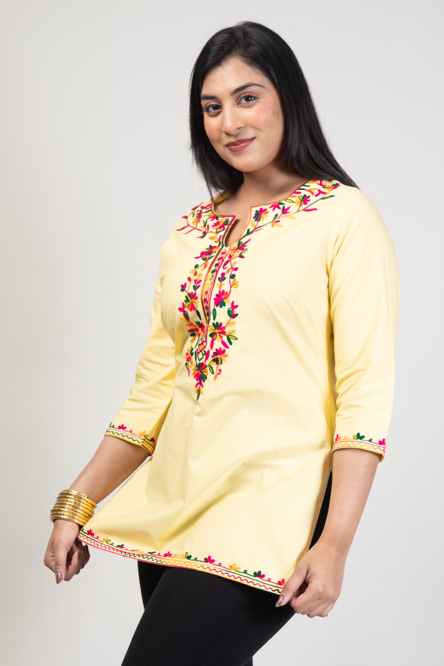 Yellow Premium Kashmiri Short cotton Kurti Styled with small U-slit cut at front and graced with Multi colour Floral Aari Work embroidery