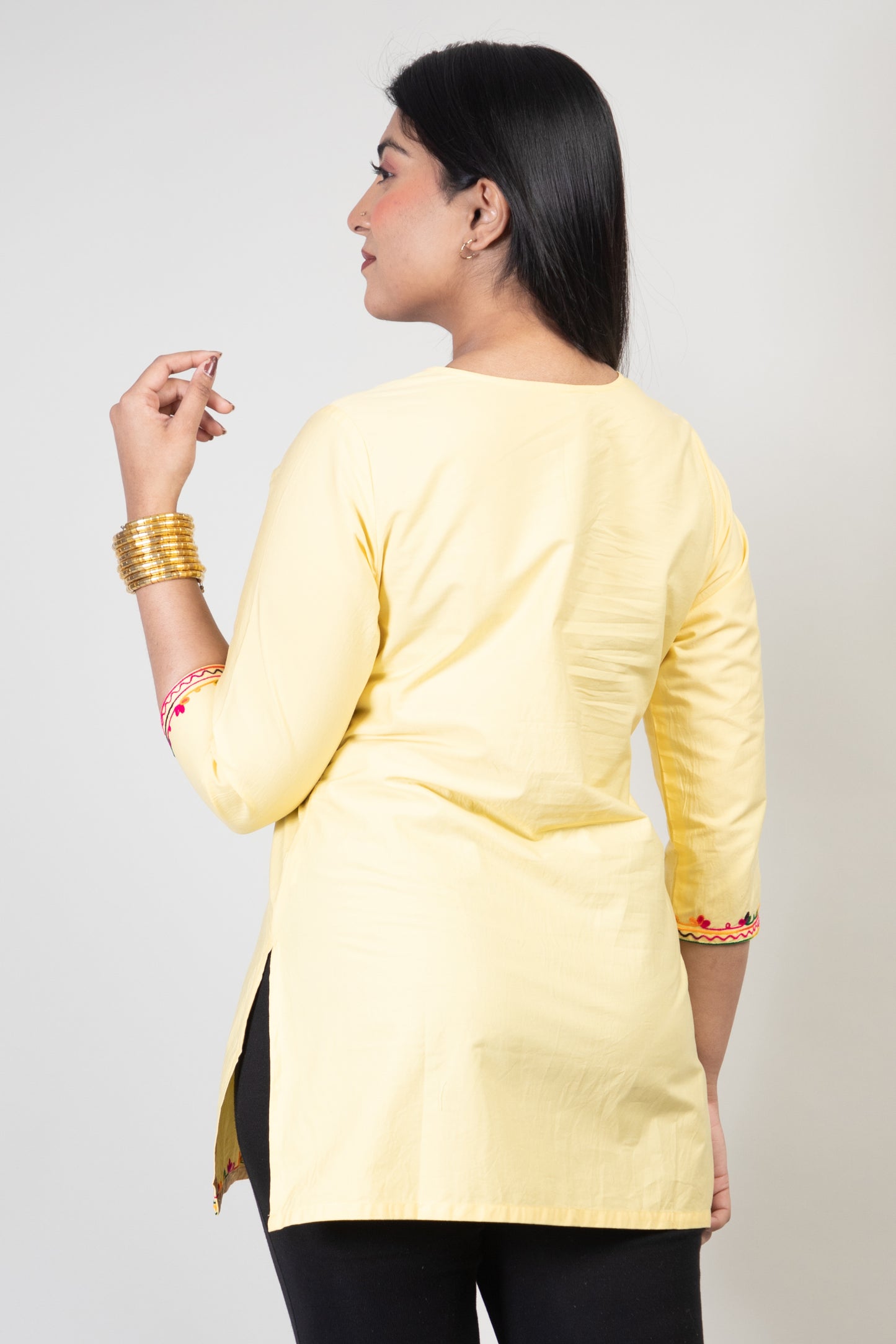 Yellow Premium Kashmiri Short cotton Kurti Styled with small U-slit cut at front and graced with Multi colour Floral Aari Work embroidery