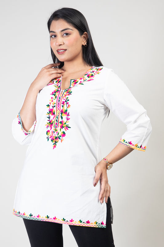 White Premium Kashmiri Short cotton Kurti Styled with small U-slit cut at front and graced with Double shaded Multi colour Floral Aari Work embroidery